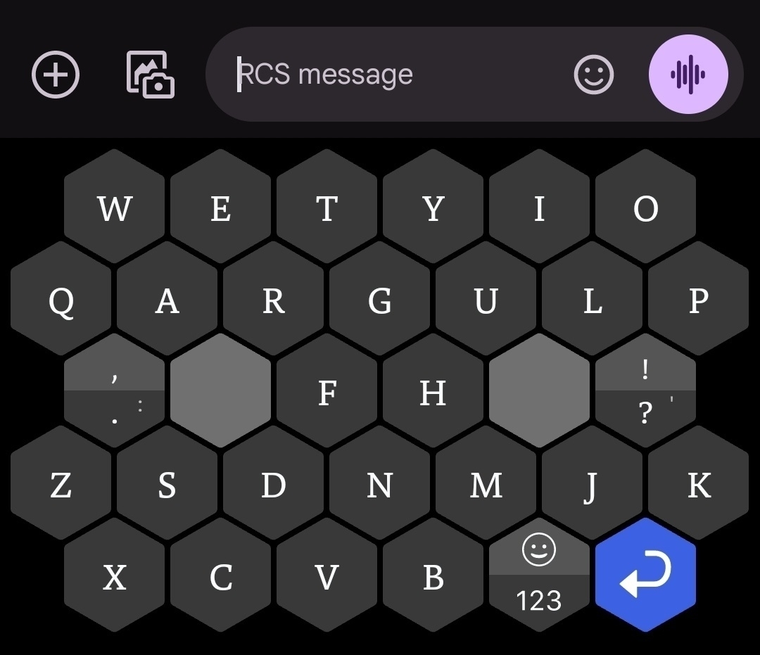 Typewise phone keyboard. The layout is a bunch of hexagons. The thumbs rest on two space keys in the middle.