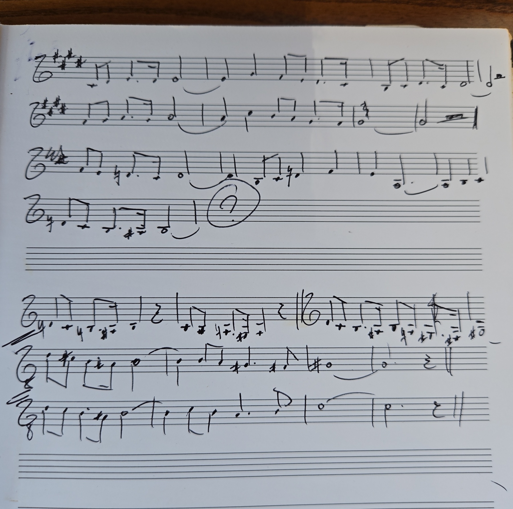 Melodic sketches on music paper. A melody with a question mark at the end is above; possible endings below.